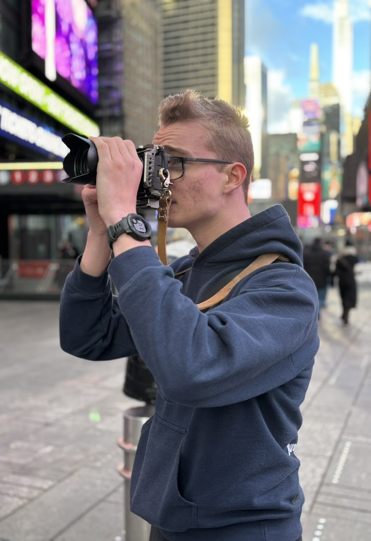Jon Barkei holding a camera